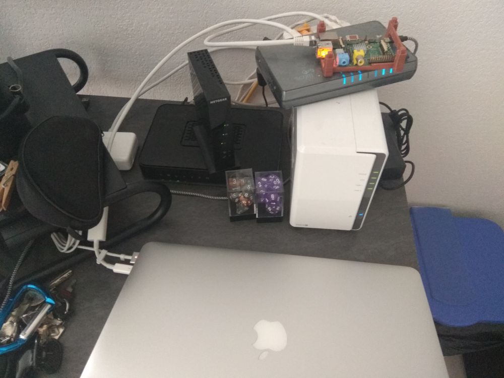 A photo displaying my macbook pro connected to the power outlet and the desk switch (by Ethernet)